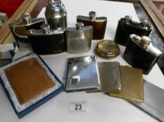 A mixed lot of hip flasks and cigarette lighters