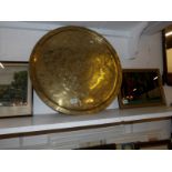 A large circular brass tray