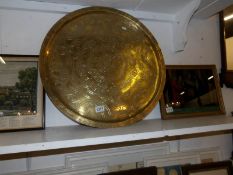 A large circular brass tray