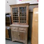 A pine glazed top cupboard