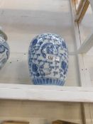 A blue and white ginger jar,