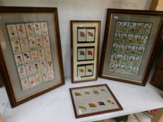 4 framed and glazed cigarette card displays including footballers and silks