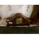 A mahogany mantel clock with walnut veneered front by E T Biggs & Sons,