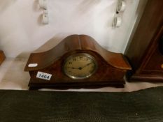 A mahogany mantel clock with walnut veneered front by E T Biggs & Sons,