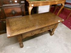 An oak 2 drawer coffee table