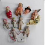 A collection of miniature vintage dolls including porcelain etc