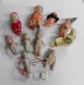 A collection of miniature vintage dolls including porcelain etc