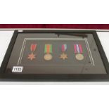 A framed and glazed set of 4 WW2 medals being 1939-45 star, Burma star,
