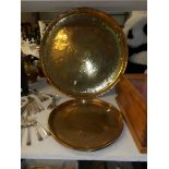 A large brass tray and one other