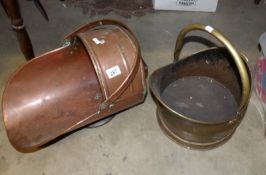 A brass coal scuttle and a copper coal scuttle