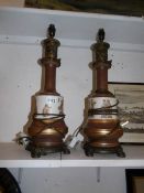 A pair of spelter and porcelain Grecian style table lamp bases