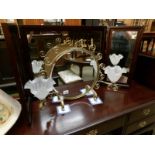 A gold painted wrought iron dressing table mirror with lamps and glass shades