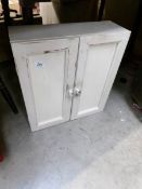 A painted pine wall cupboard