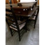 An oak refectory table and 6 chairs