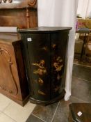 A 19th century bow front corner cupboard with Oriental lacquered doors