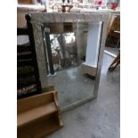 A good quality bevel edged mirror in a metalic silver coloured frame