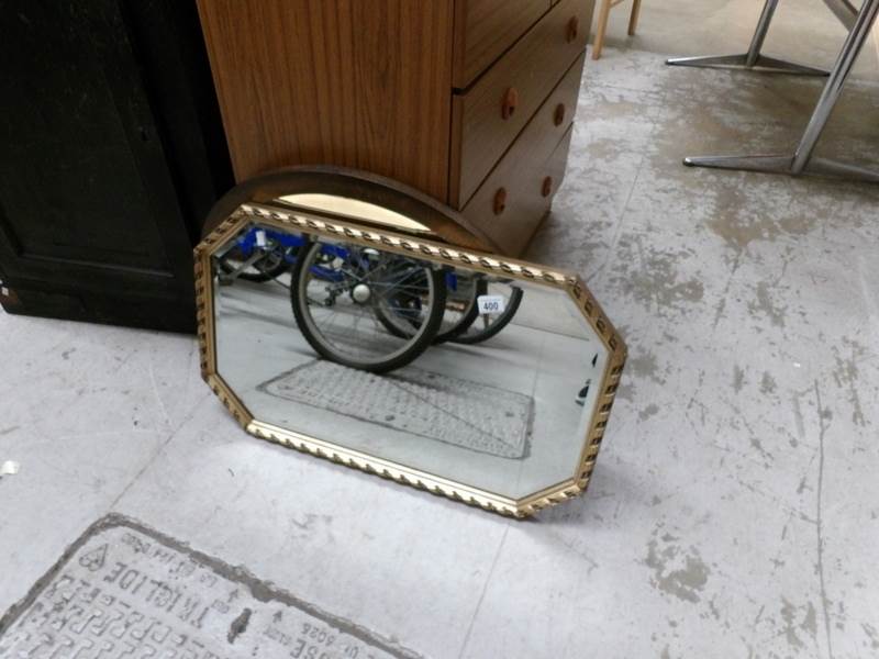 A gilt framed mirror and one other