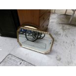 A gilt framed mirror and one other