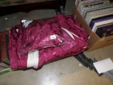 A quantity of dark red brocade curtains with tie backs