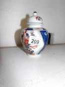 A small Oriental lidded jar