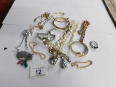 A mixed lot of jewellery and watches