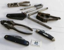 A mixed lot of nutcrackers and penknives