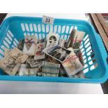 A basket of cigarette cards including De Reskze, Will's, Players,