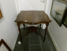 A mahogany occasional table