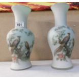 A pair of Victorian style glass vases decorated with birds