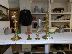 2 pairs of brass candlesticks