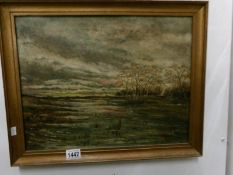 An oil on canvas 'Marsh Land' scene initialed F.M.T. 1914