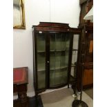 A mahogany inlaid display cabinet