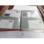A folder and a small box of loose first day covers and envelopes,