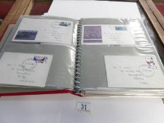 A folder and a small box of loose first day covers and envelopes,