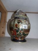 A 31cm tall signed ginger jar with cover