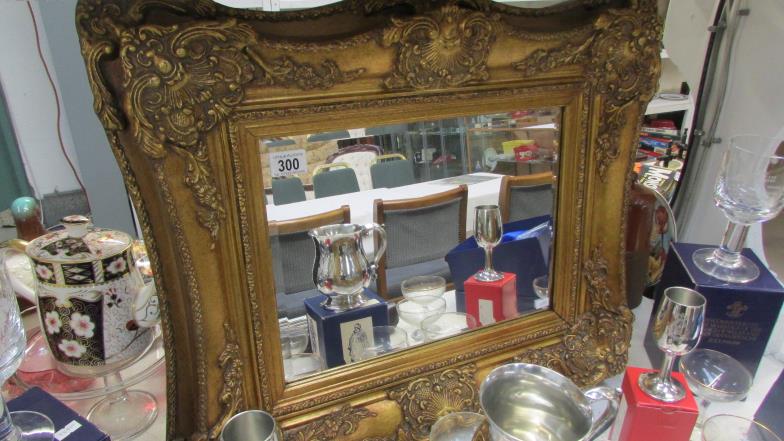 A gilt framed mirror