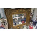 A gilt framed mirror