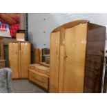A 1960's maple walnut bedroom suite comprising 2 wardrobes, dressing table,