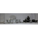 A part porcelain coffee set and a part tea set,