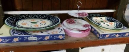 A boxed cake stand and 2 platters