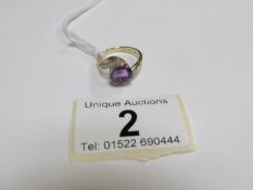 A 9ct gold ring set oval amethyst and pave' diamonds,