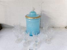A blue glass cookie jar and a set of 6 glasses