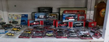 A large quantity of boxed Cararama die cast cars etc