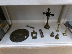A brass crucifix and other brass items