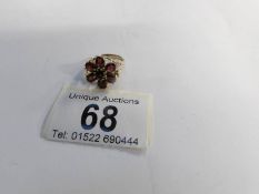 A garnet cluster ring in 9ct gold size M