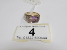 A 9ct gold ring set a superb 'Ametrine' stone and diamond shoulders,
