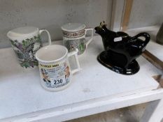 A black cow creamer and 3 interesting tankards