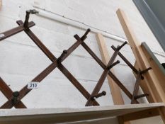 An Edwardian extending coat rack