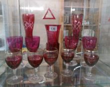 13 pieces of cranberry glass including vases