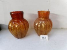 A pair of gold flecked art glass vases